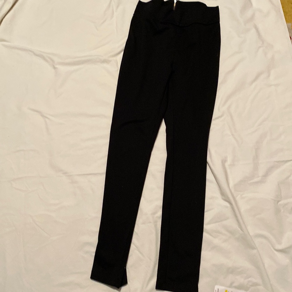 Black stretchy pants. For working out . Or looks great with a long too.